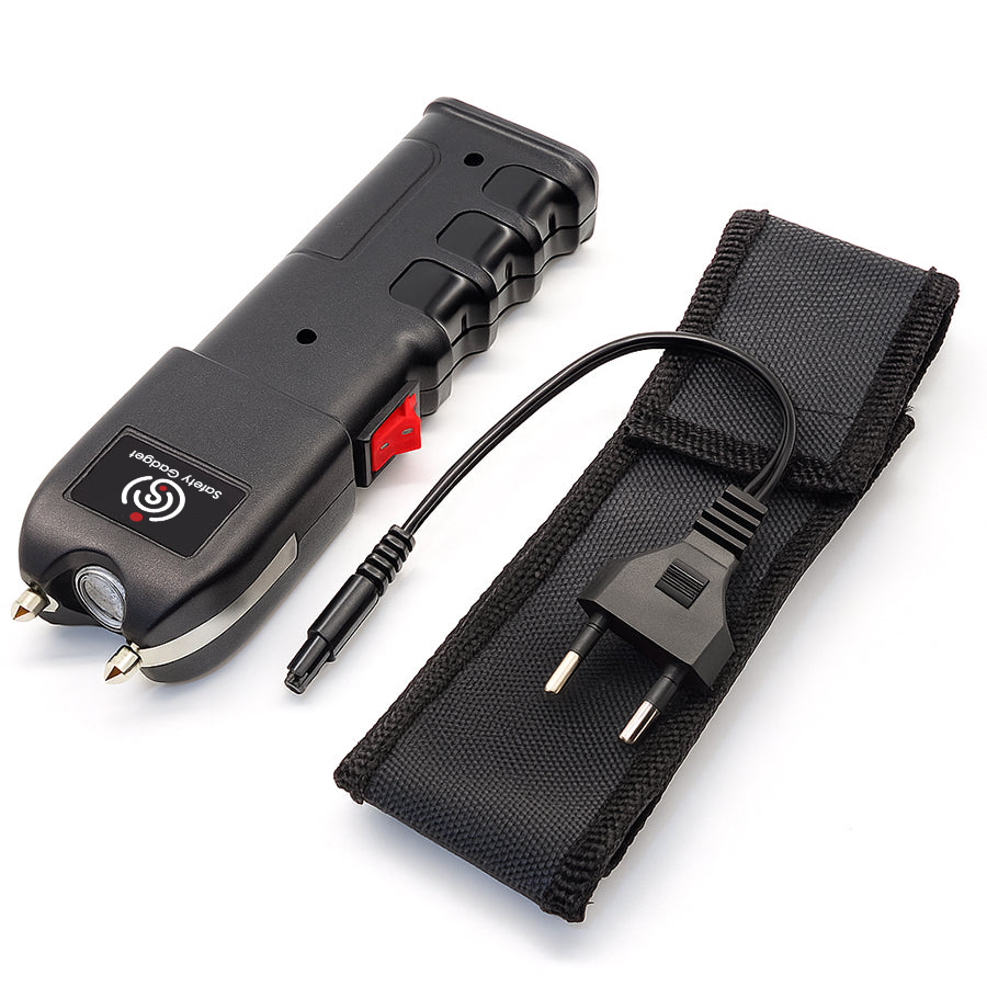 Black electronic device with cable and strap on a white background