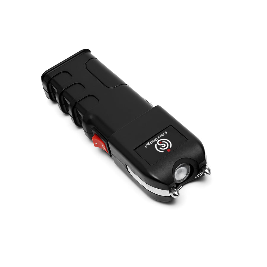 Black pepper spray device with a visible brand logo on a white background