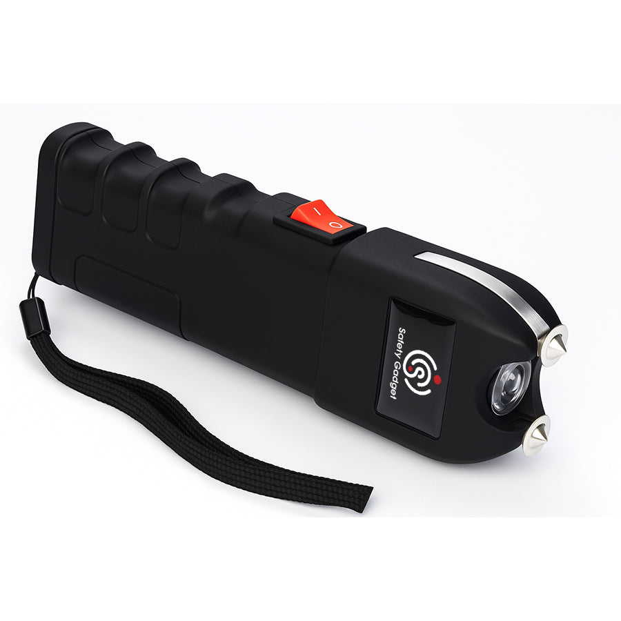 Black pepper spray device with a red button on a white background